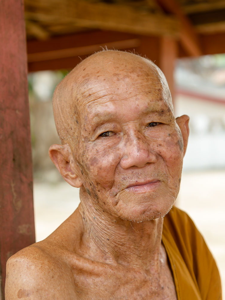 LA160109-Elderly-monk-in-fishing-village-upon-the-Mekong.jpg